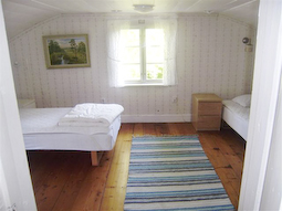 Upper floor bedroom with two beds